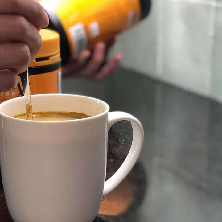 TurmeriX turmeric powder mixed into warm water drink