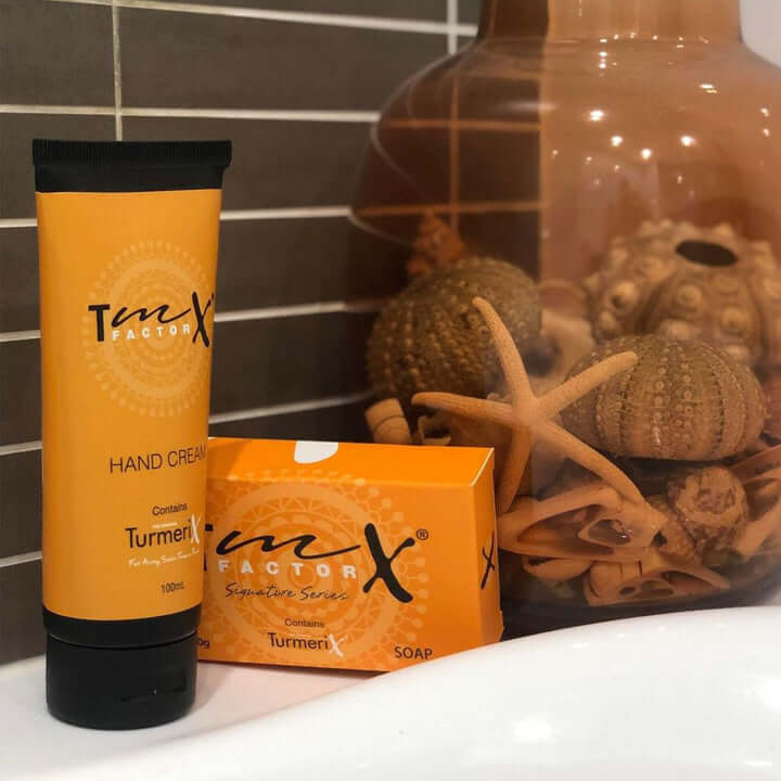 TmX Factor turmeric soap with hand cream bathroom display